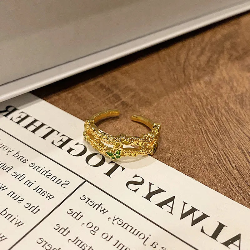 Simple copper women's ring with a Chinese butterfly design, showing an example from the 33 available numbered styles.