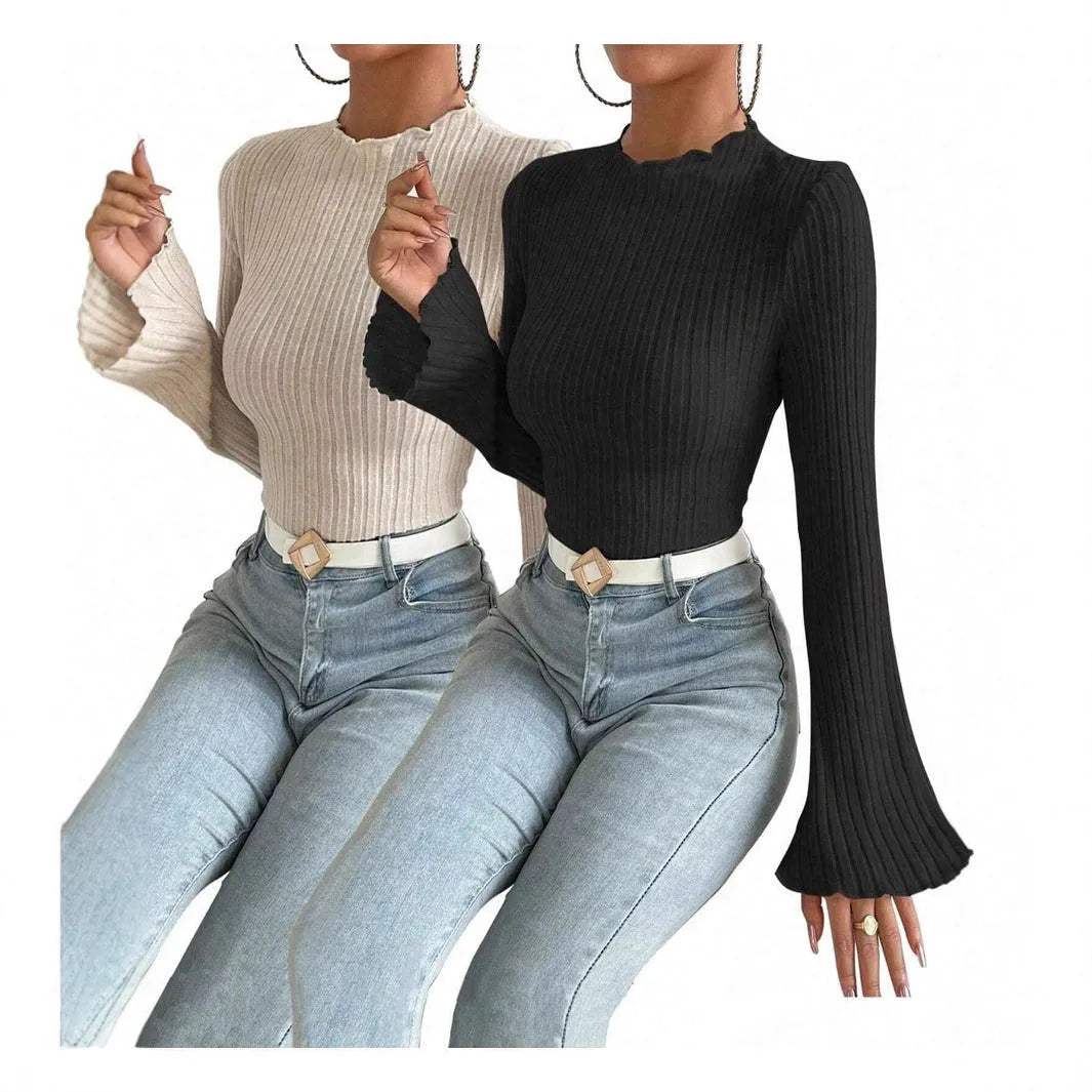 A black long sleeve round neck top with lantern sleeves and a slim fit, showcasing a brushed polyester fabric.