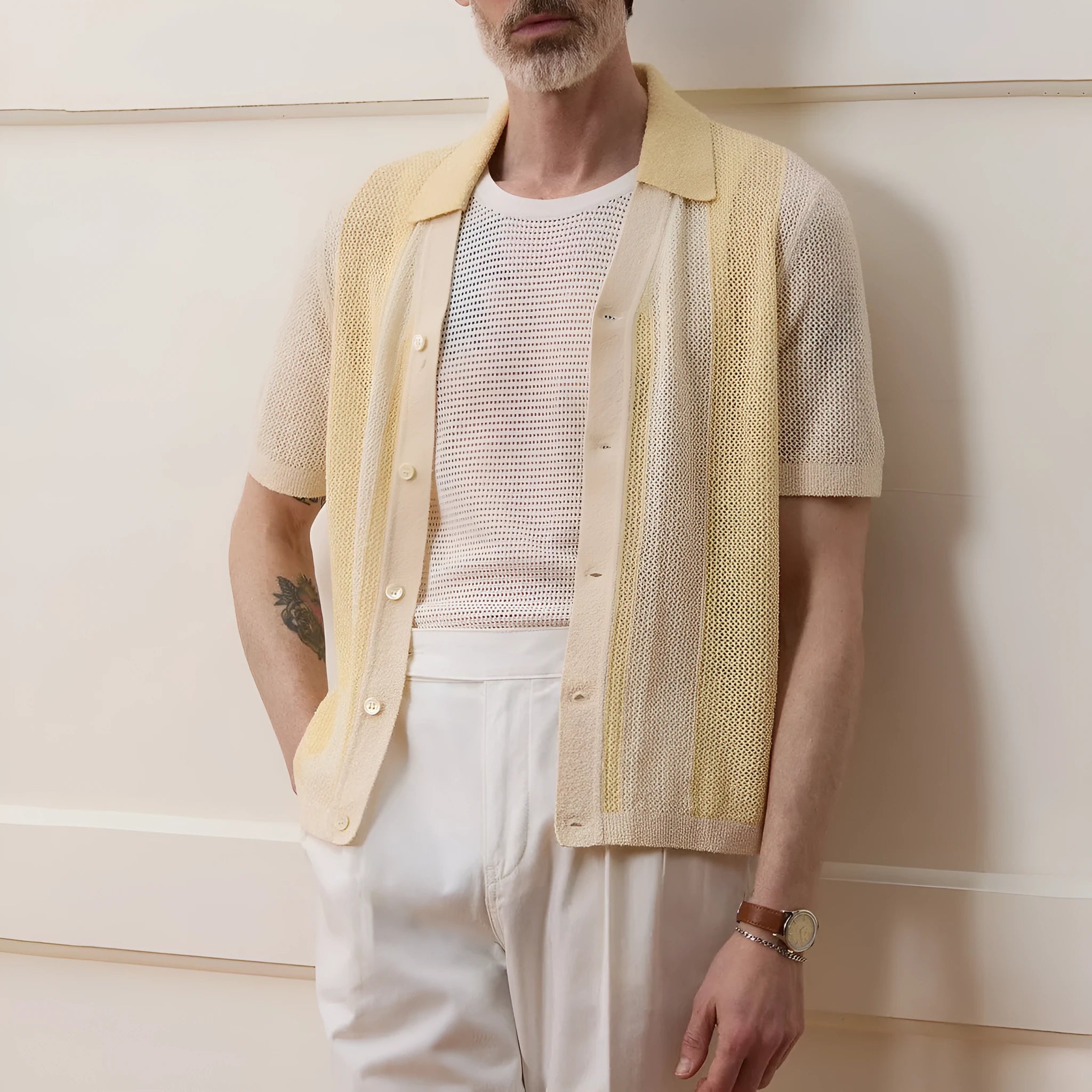 Yellow casual polo shirt with hollow-out design and asymmetric cut, short sleeves, made from Tencel fabric.