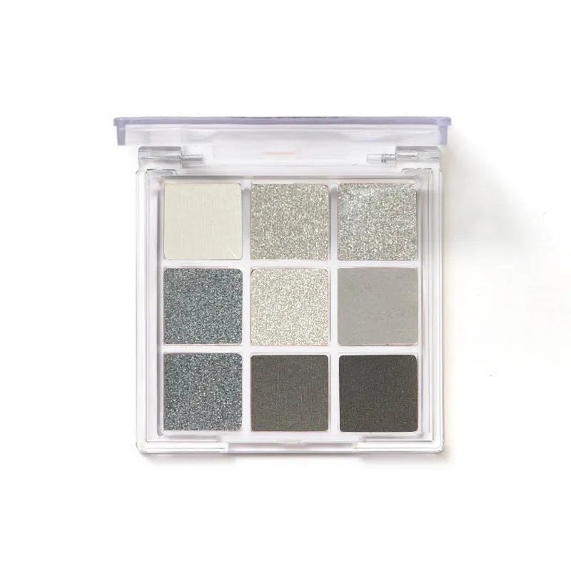 Smoked nine-colour eyeshadow palette with white, silver, black, and iron grey shades.