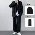 Plus size men's college style suit set featuring a jacket, trousers, white shirt and tie on a hanger.