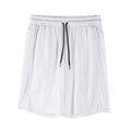 Man wearing black quick-dry mesh capri shorts with a loose, casual fit.