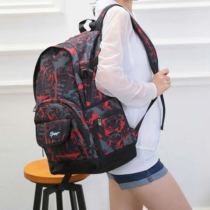 Blue and red classic nylon backpack with large main compartment and adjustable shoulder straps.