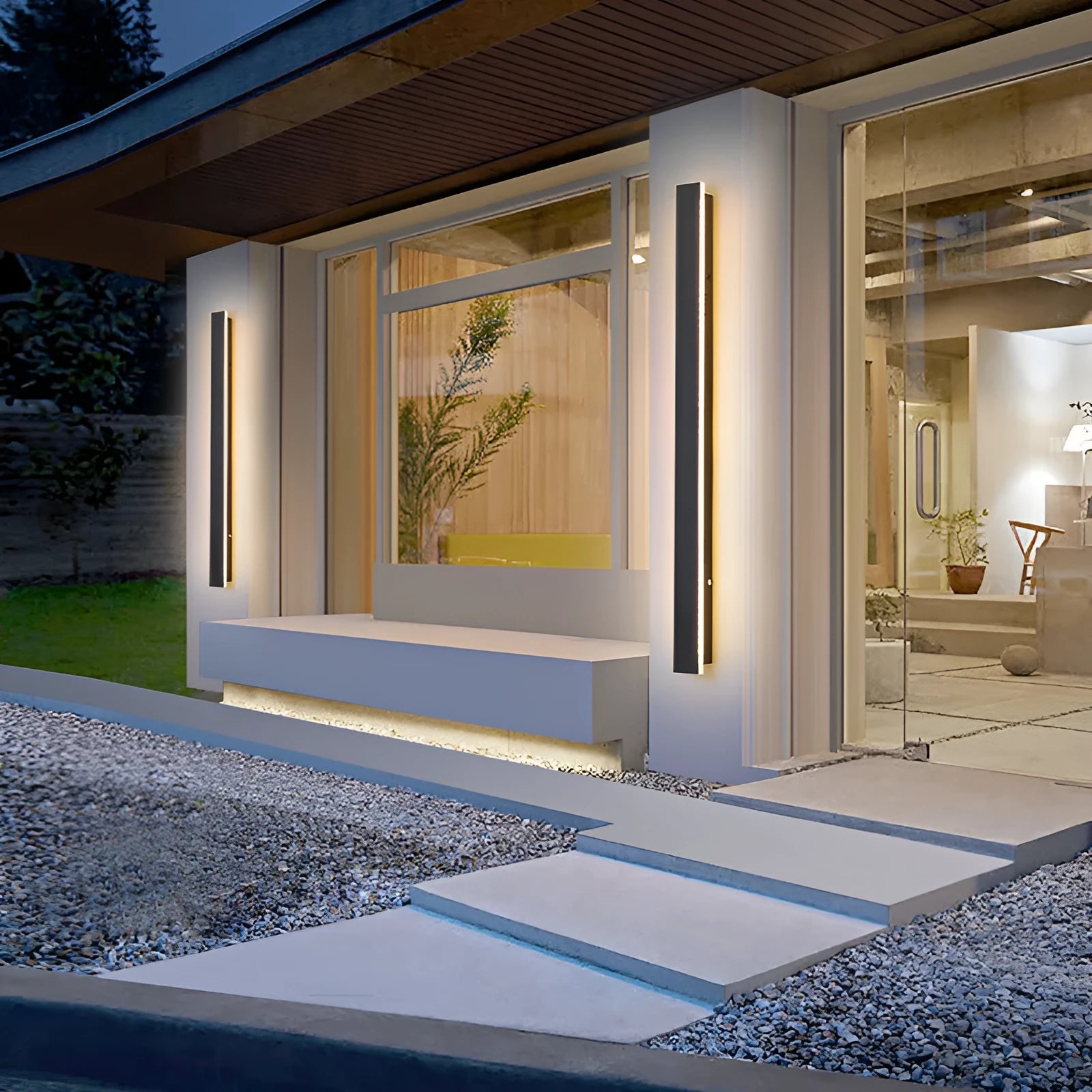 Straight outdoor LED wall lamp with wrought iron shell mounted on an exterior wall.