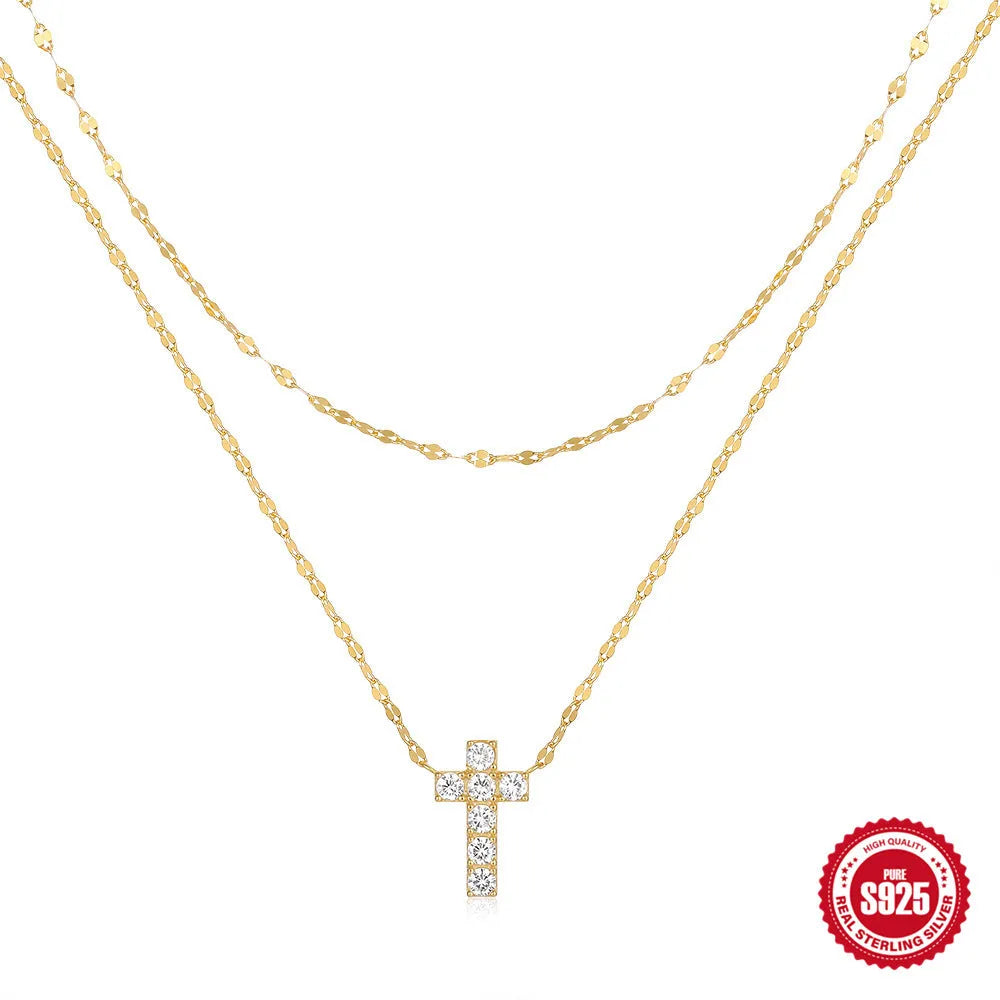 S925 sterling silver double layer cross pendant necklace with diamond cut detail on a clavicle chain.