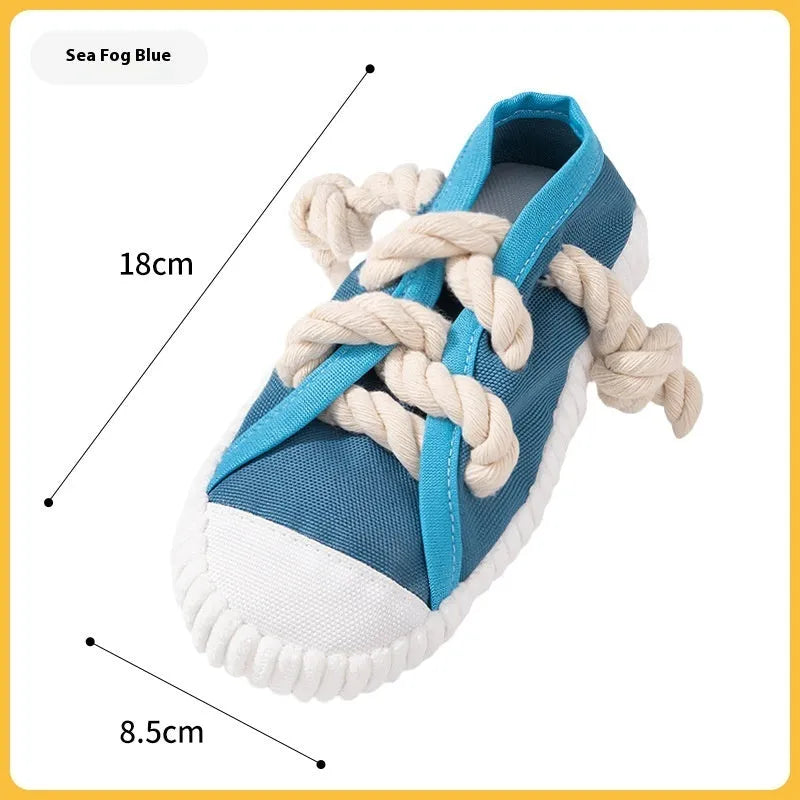 Squeaky plastic dog slippers toy in yellow, black, or blue colour for chewing and play.