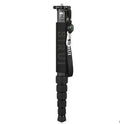 Black carbon fibre telescopic camera monopod fully extended next to an SLR camera