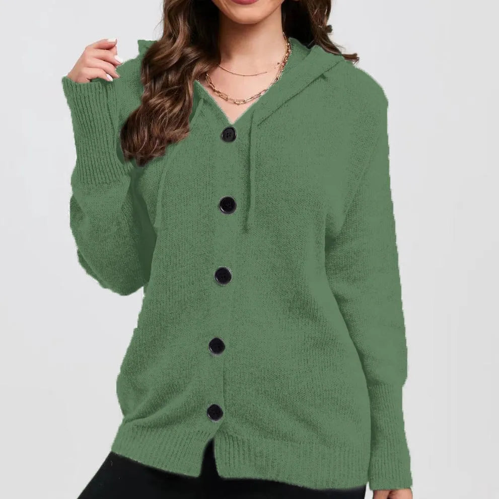 Women's loose fit thick cotton hooded cardigan sweater in a solid colour on a hanger.