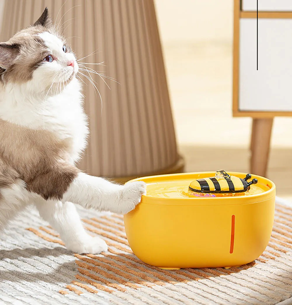 Yellow cat water fountain with filtration system and USB cable for automatic recirculating pet water