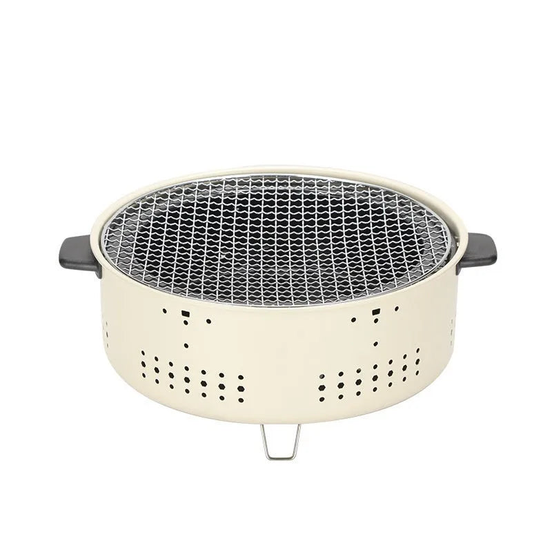 Modern indoor portable charcoal cooking stove with a detachable circular grill rack on top.