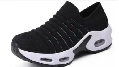 Plus size women's stretch knitted sock shoe in blue with mesh upper and low heel.