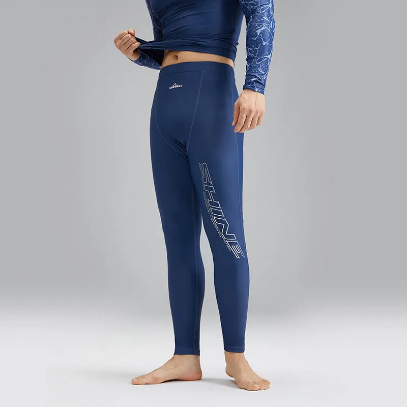 Men's dark blue patterned nylon swimwear set with matching top and trousers