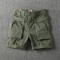 Men's straight-leg cotton cargo shorts in khaki with multiple pockets.