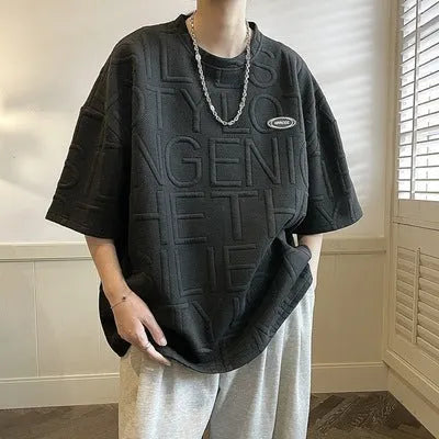 Men's grey short sleeve t-shirt with three-dimensional letter pattern and loose fit design