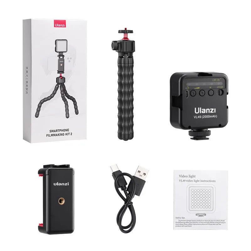 Silver aluminium tripod stand extended for camera or smartphone vlogging.