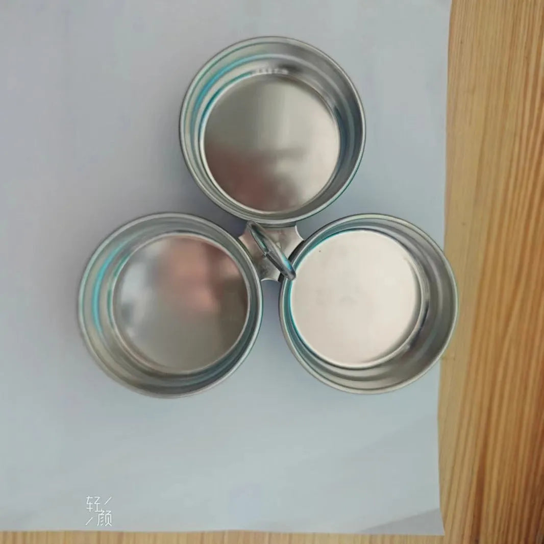 Mini stainless steel egg steamer for creating heart-shaped and round boiled eggs.