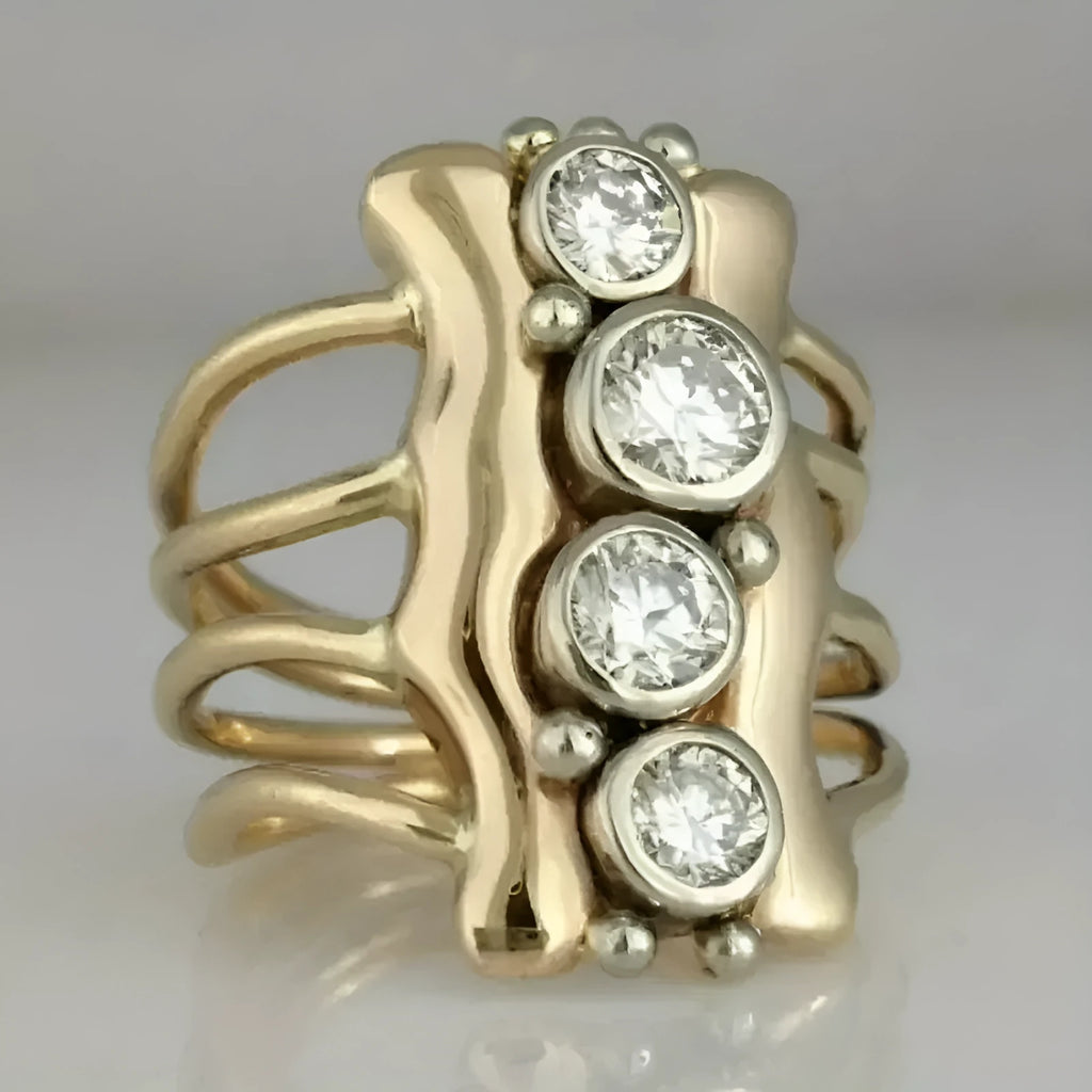 Gold electroplated zinc alloy retro creative fashion ring for women on a plain background