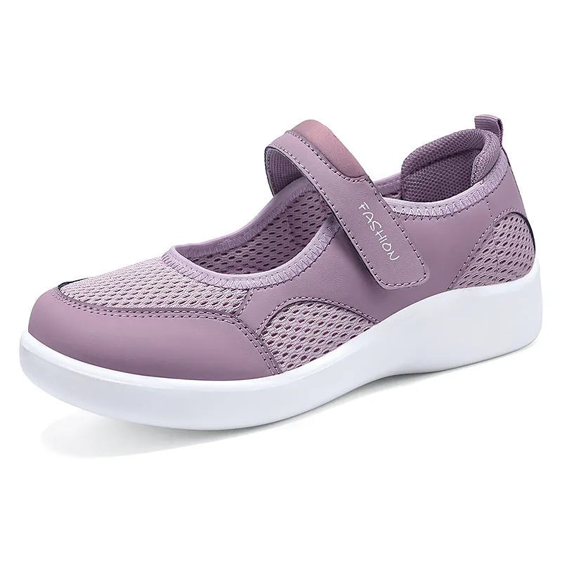 Women's low-top casual shoes in grey with mesh upper and Velcro strap.