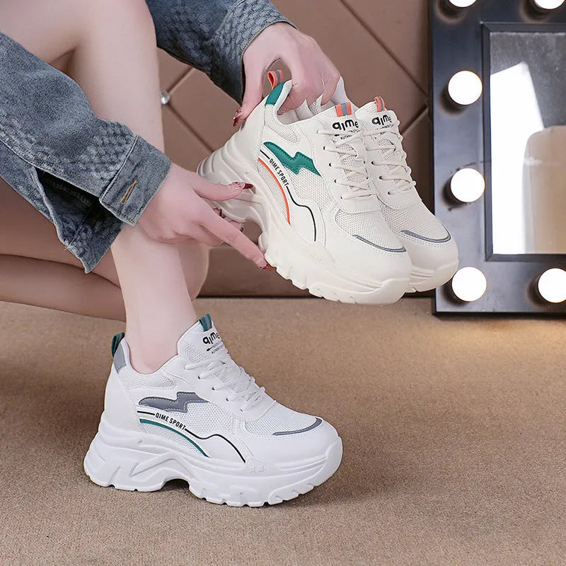 Women's white breathable dad shoes with lace-up front and cross shoulder straps on a rubber sole.