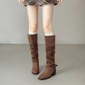 Chunky heel wrinkled stacked ankle Martin boots in khaki, showing hollow out detail and square toe on synthetic leather upper