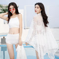 Women's three-piece bikini set in black with high-waist shorts, half-sleeve top, and matching coat