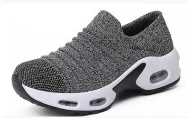 Plus size women's stretch knitted sock shoe in blue with mesh upper and low heel.