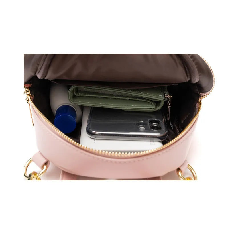 Soft PU mini backpack in street trend style with multiple internal compartments including mobile phone pocket