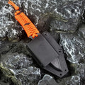 Straight camping survival knife with binding rope handle next to ABS sheath