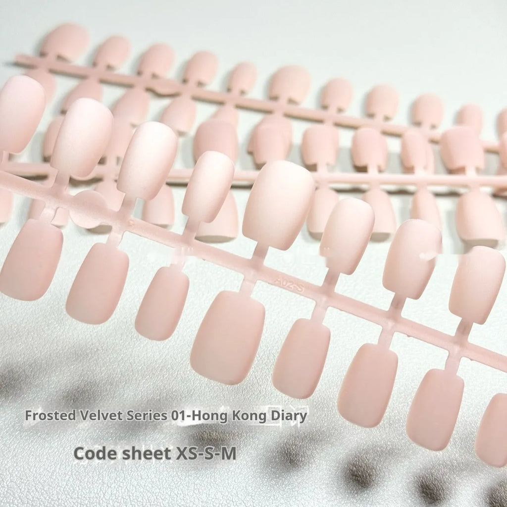 Set of frosted velvet Cat's Eye press-on nails with Aurora shimmer in short ladder sizes XS, S, and M.