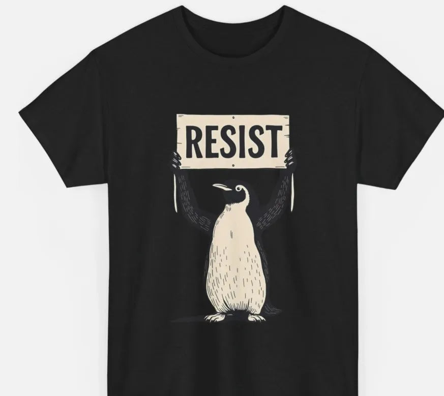 A loose-fitting black short-sleeve cotton t-shirt with a round neck on a hanger.