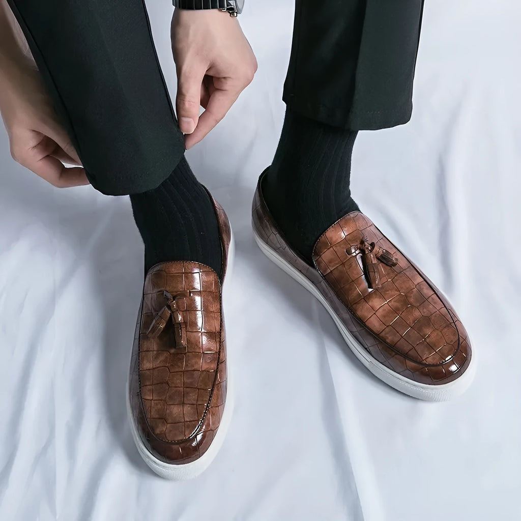Men's brown artificial PU sneakers with a tassel detail and round toe on a rubber sole.