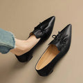 Women's low heel pointed toe shoes in black with PU upper and soft surface finish