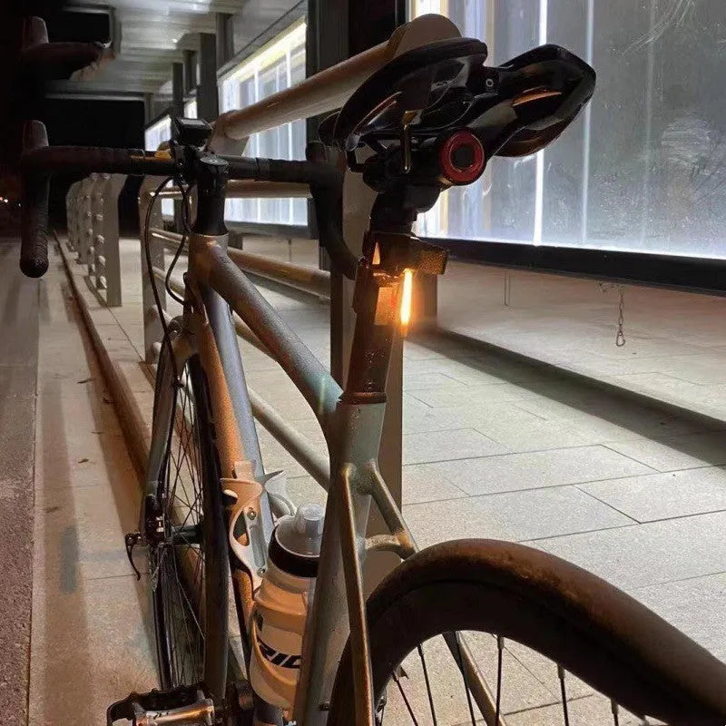 Motorcycle taillight with USB charging and waterproof design in yellow colour for night riding