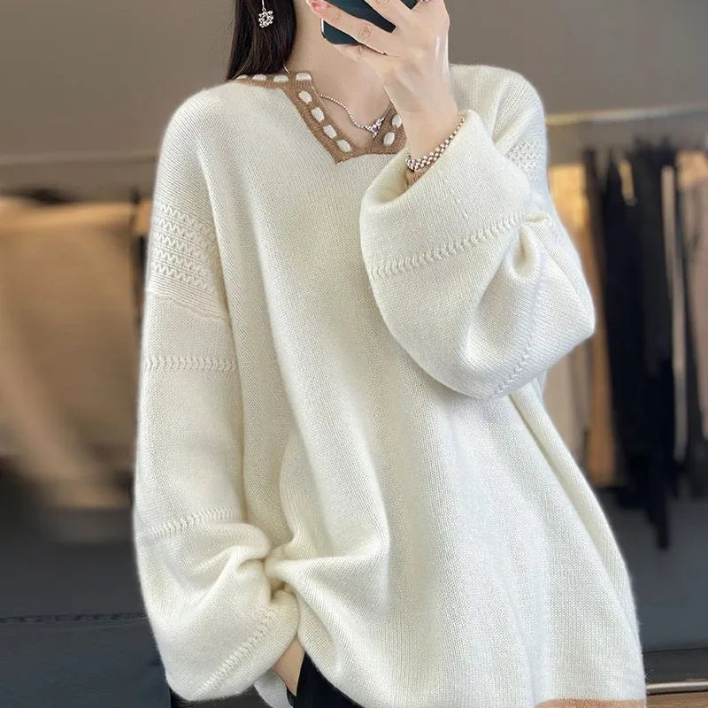 Women's white V-neck viscose pullover sweater showing long sleeves and regular fit.