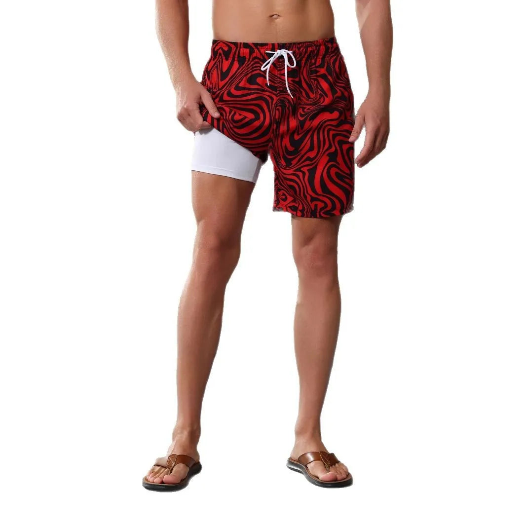 Man's quick-drying polyester beach shorts with liner in a grey camouflage pattern, showing stretch fabric.