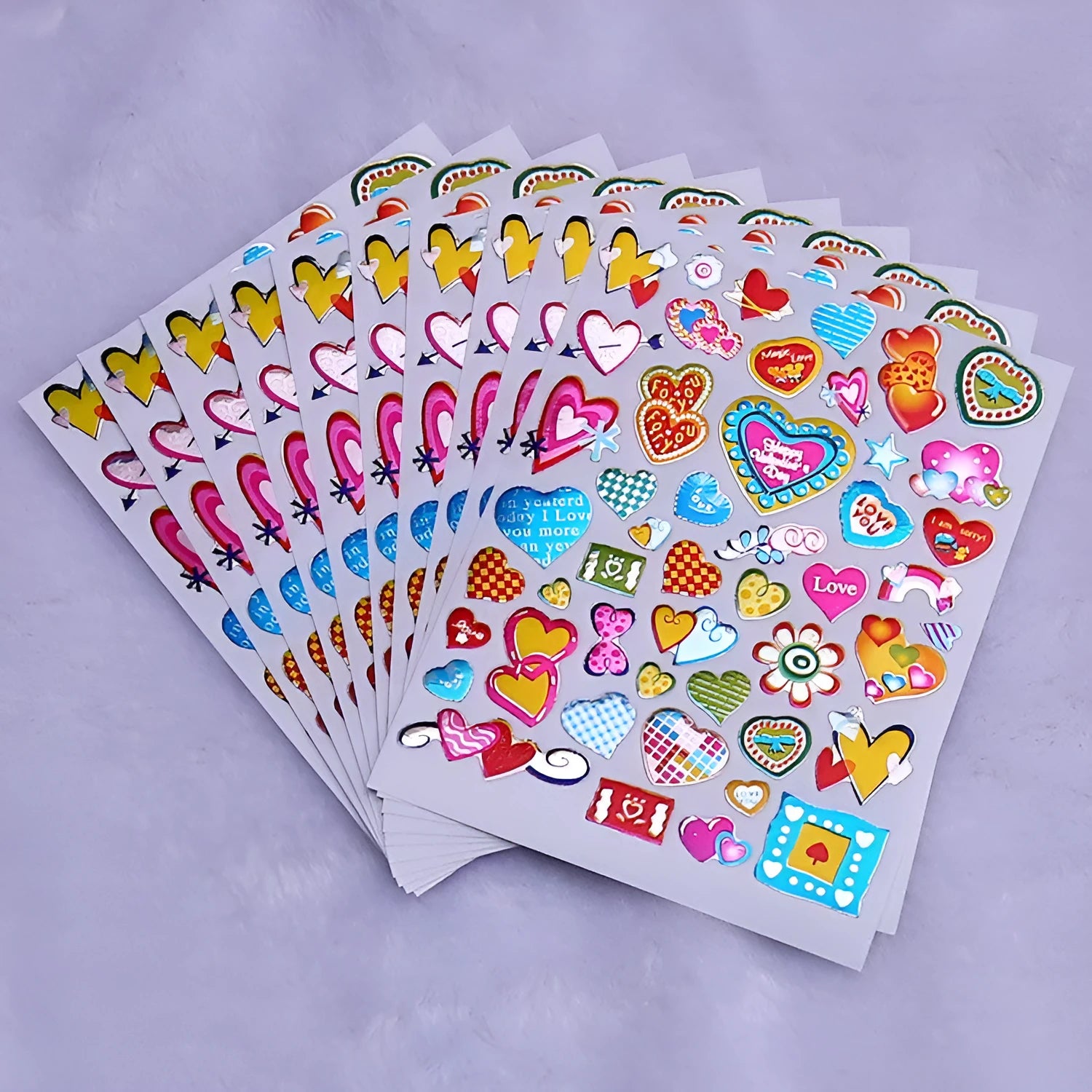 Waterproof plastic reward stickers with gilded cartoon heart designs in 100-piece pack