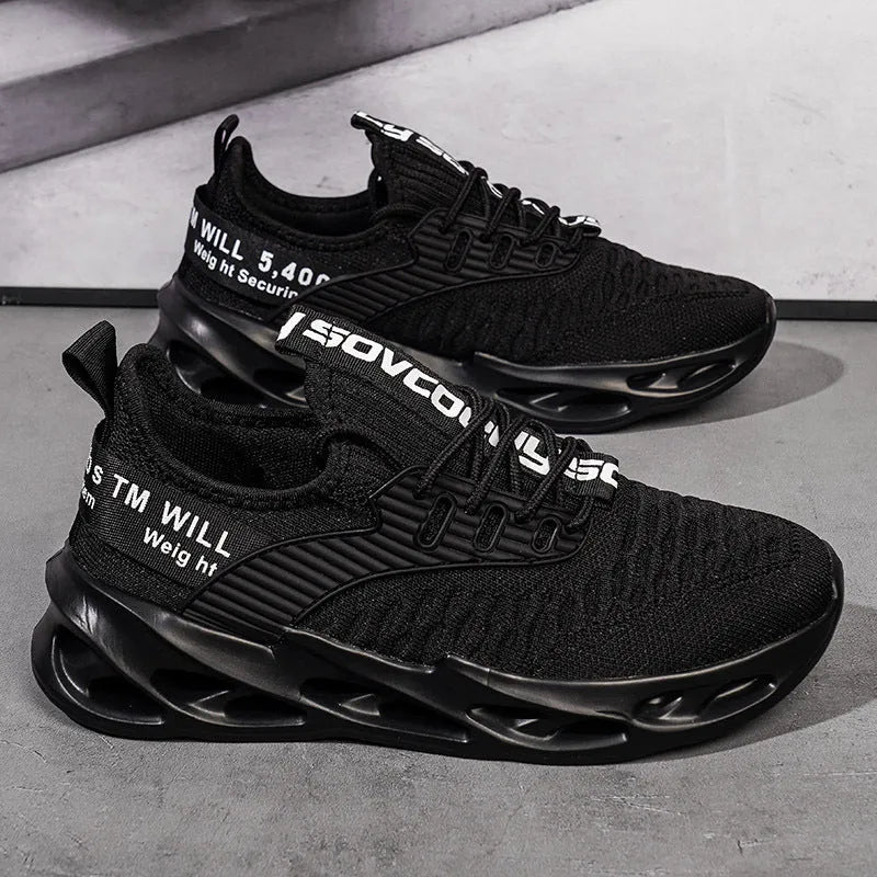 Women's FlyKnit mesh casual trainers in black, showing round toe and flat heel design.