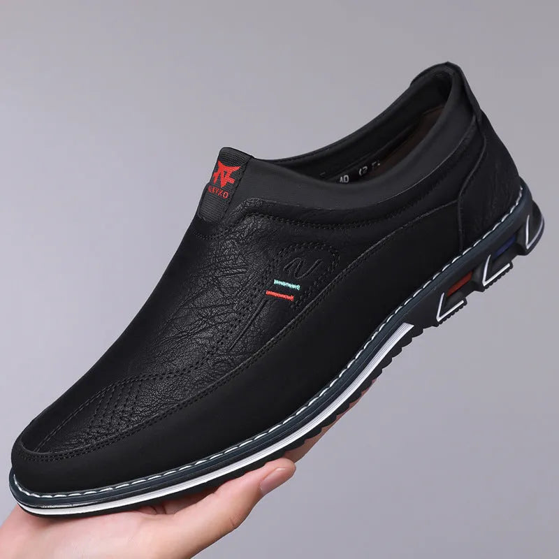 Men's low-top casual leather shoes with a leather toe cap and sewing line detail on fabric upper.