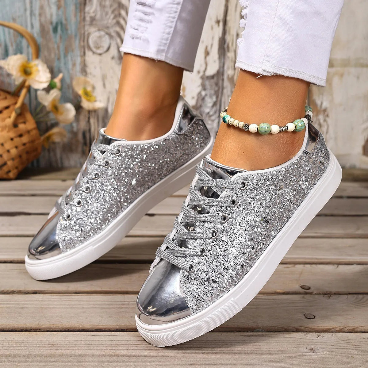 Women's plus size black sequined lace-up board shoes with flat rubber sole.