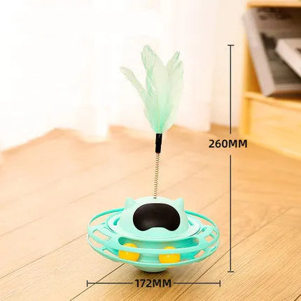 Pink rotating cat tumbler toy measuring 17 by 10 centimetres on a flat surface