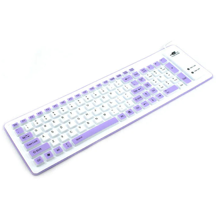 Folding silicone keyboard in pink with USB cable, placed on a desk