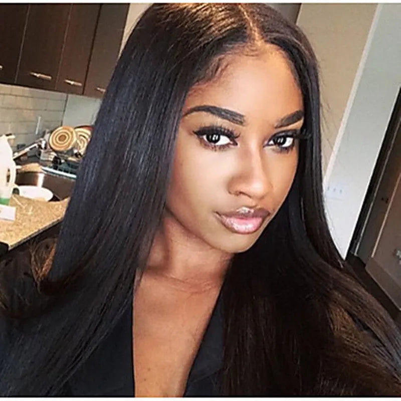 Long straight black synthetic wig with centre-parted bangs on a mannequin head.