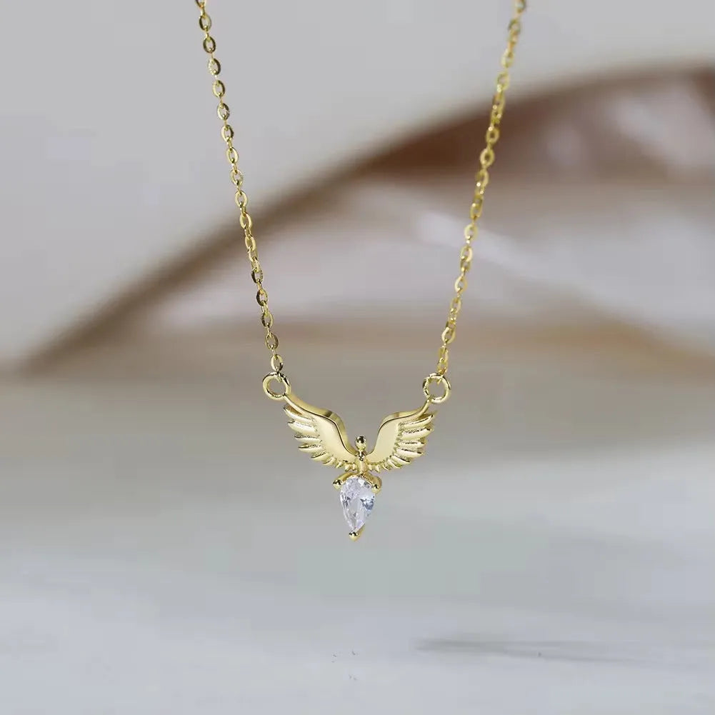 Women's silver eagle pendant necklace on an O-ring chain in white gold or yellow gold colour.