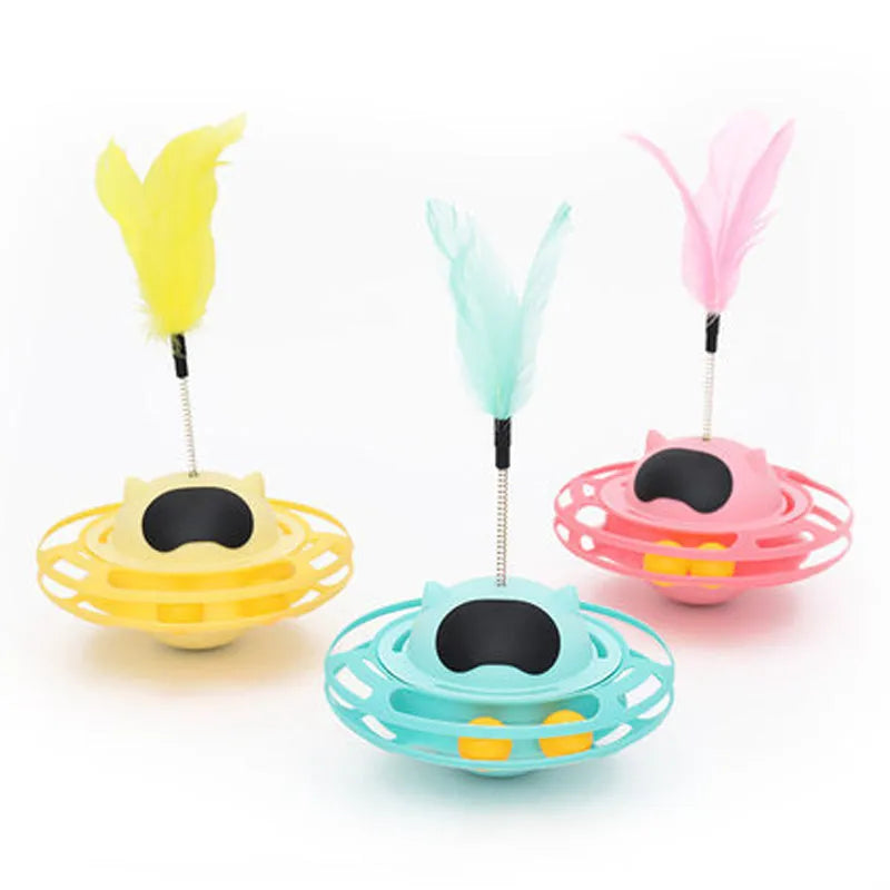 Pink rotating cat tumbler toy measuring 17 by 10 centimetres on a flat surface
