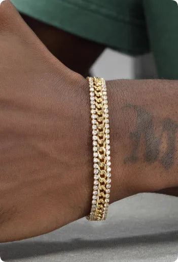 Gold-coloured hip hop style tennis bracelet for men and women on a wrist.