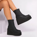 Plus size black wedge heel boots with a waterproof platform and high cylinder design.