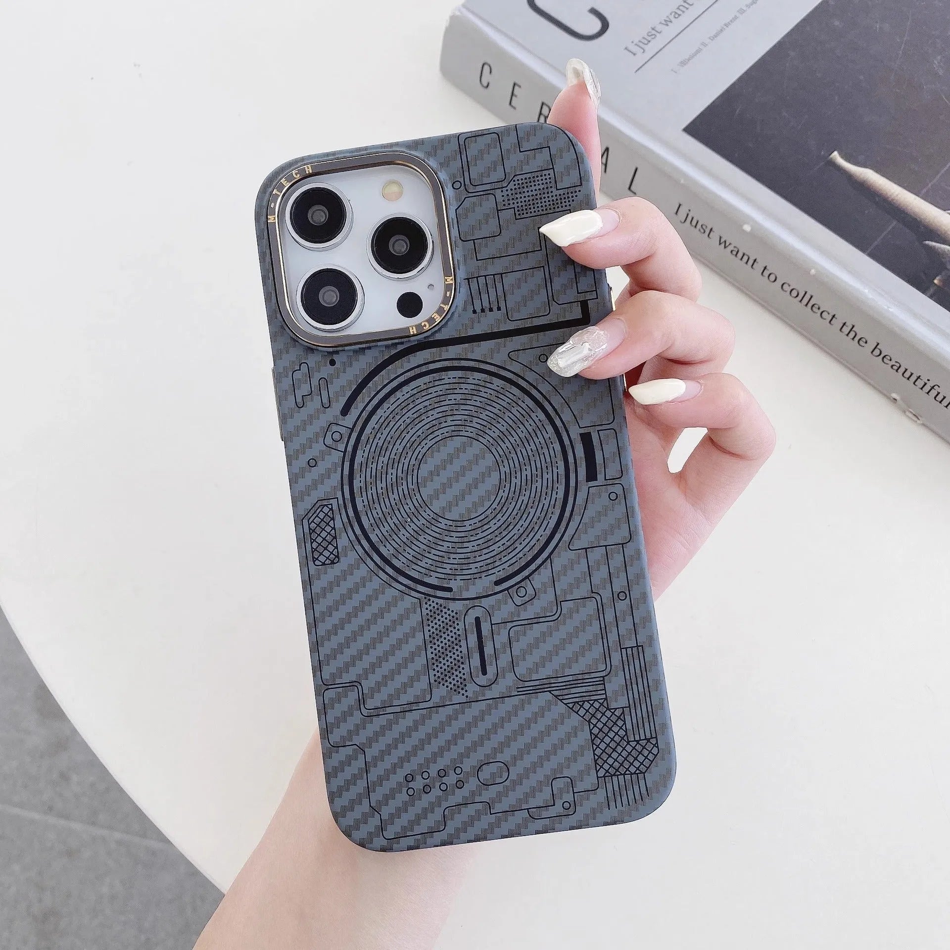 PC phone case with carbon fiber grain texture, Graphite Black colour, magnetic ring visible, for iPhone series.