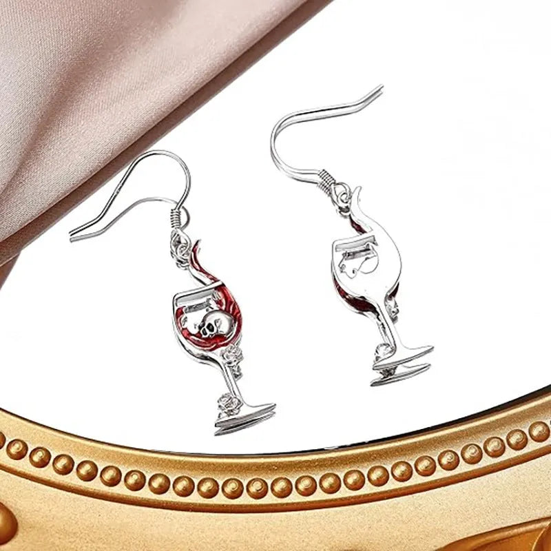 Silver tone zinc alloy Halloween earrings with a combined skull and wine glass geometry design.