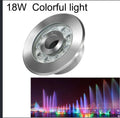 Aluminium alloy outdoor underwater lamp shown illuminated in a garden water feature.