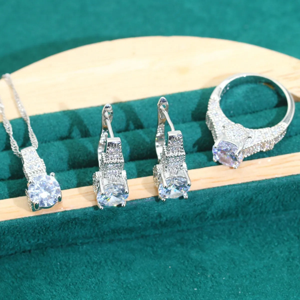 Four-piece bridal jewellery set showing necklace, bracelet, earrings and ring with alloy zircon and water wave chain design